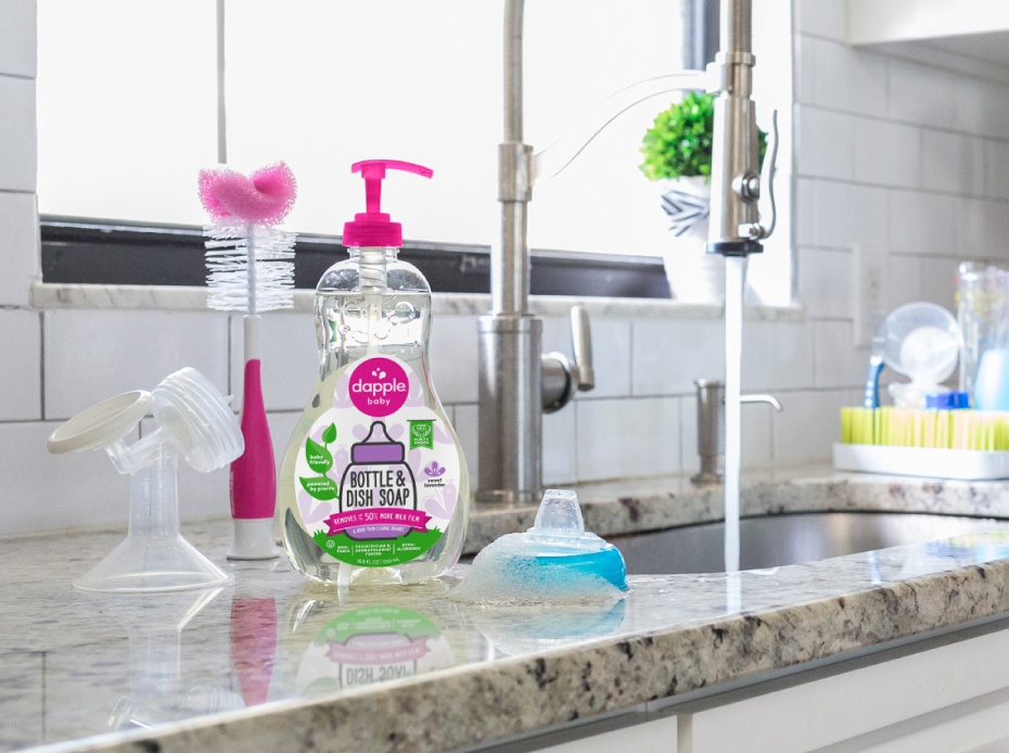 Image of kitchen counter with a bottle of Dapple Baby dish soap sitting next to a sink.