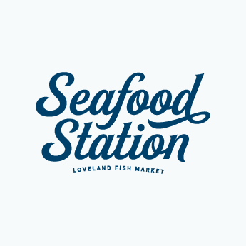 The main Seafood Station logo, in a navy blue script font on white background.