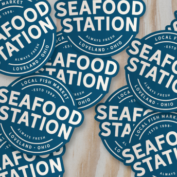 An image showing stickers of a variation of the Seafood Station logo.