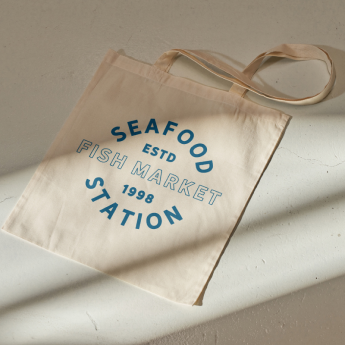 An image of a branded canvas tote bag created for Seafood Station.