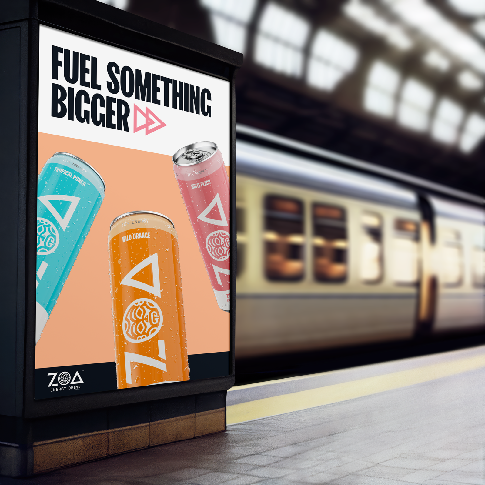 A vertical digital billboard in a subway station featuring ZOA Energy